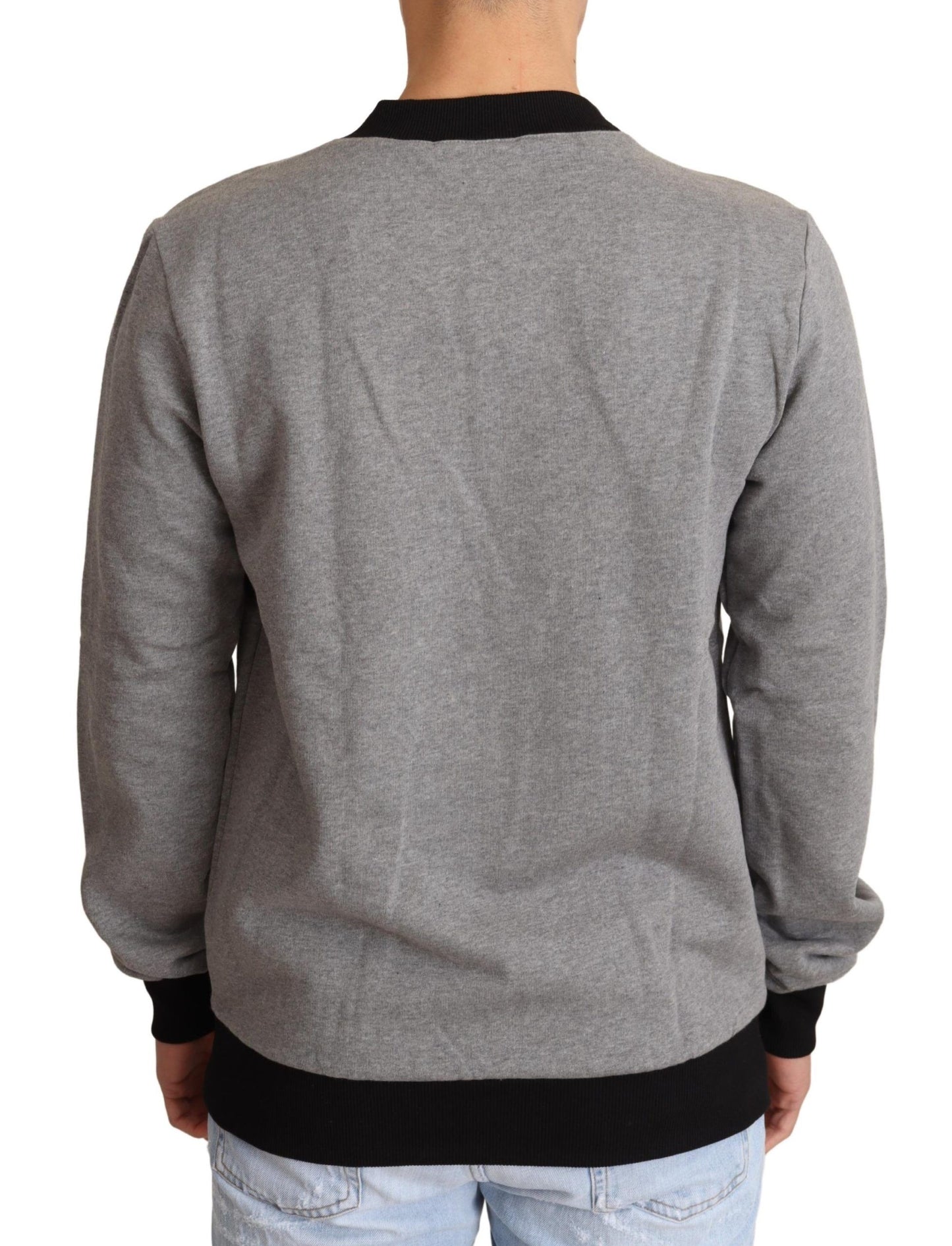 Dolce & Gabbana Elegante suéter gris con cuello redondo y motivo de corona