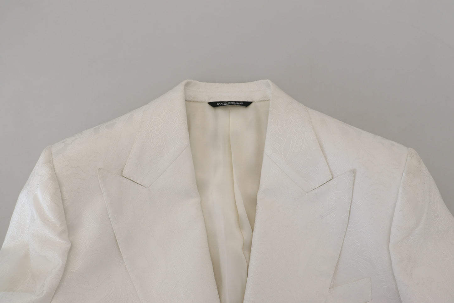 Dolce & Gabbana Elegante gabardina con brocado floral blanco