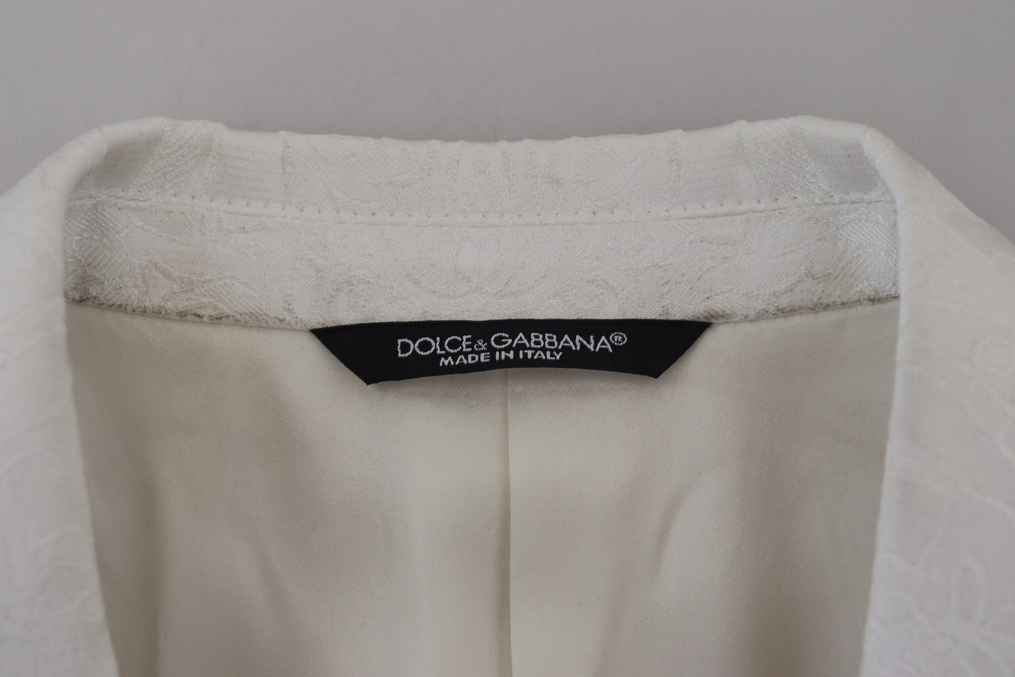 Dolce & Gabbana Elegante gabardina con brocado floral blanco