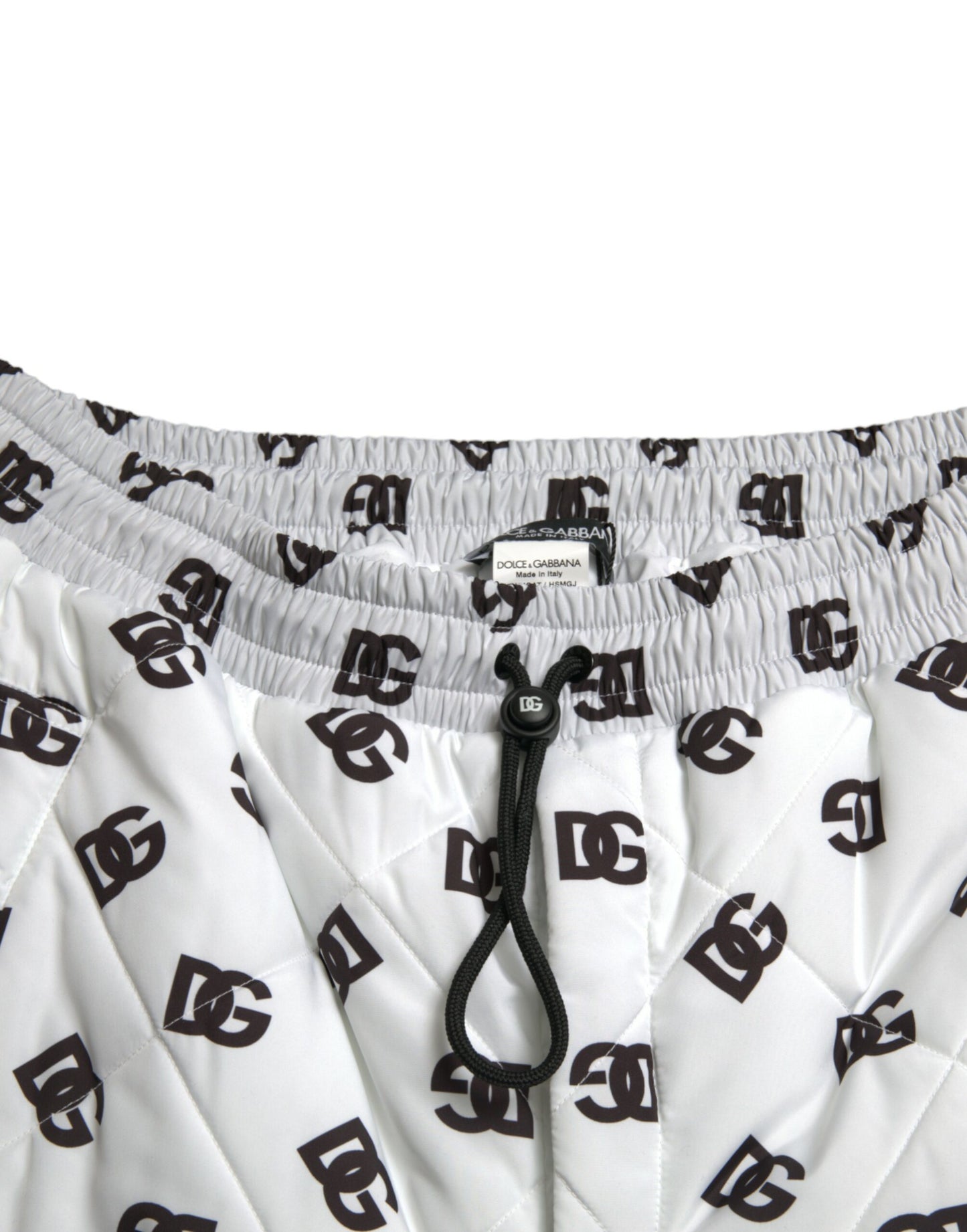 Pantalones deportivos blancos elegantes de Dolce & Gabbana con el icónico estampado DG