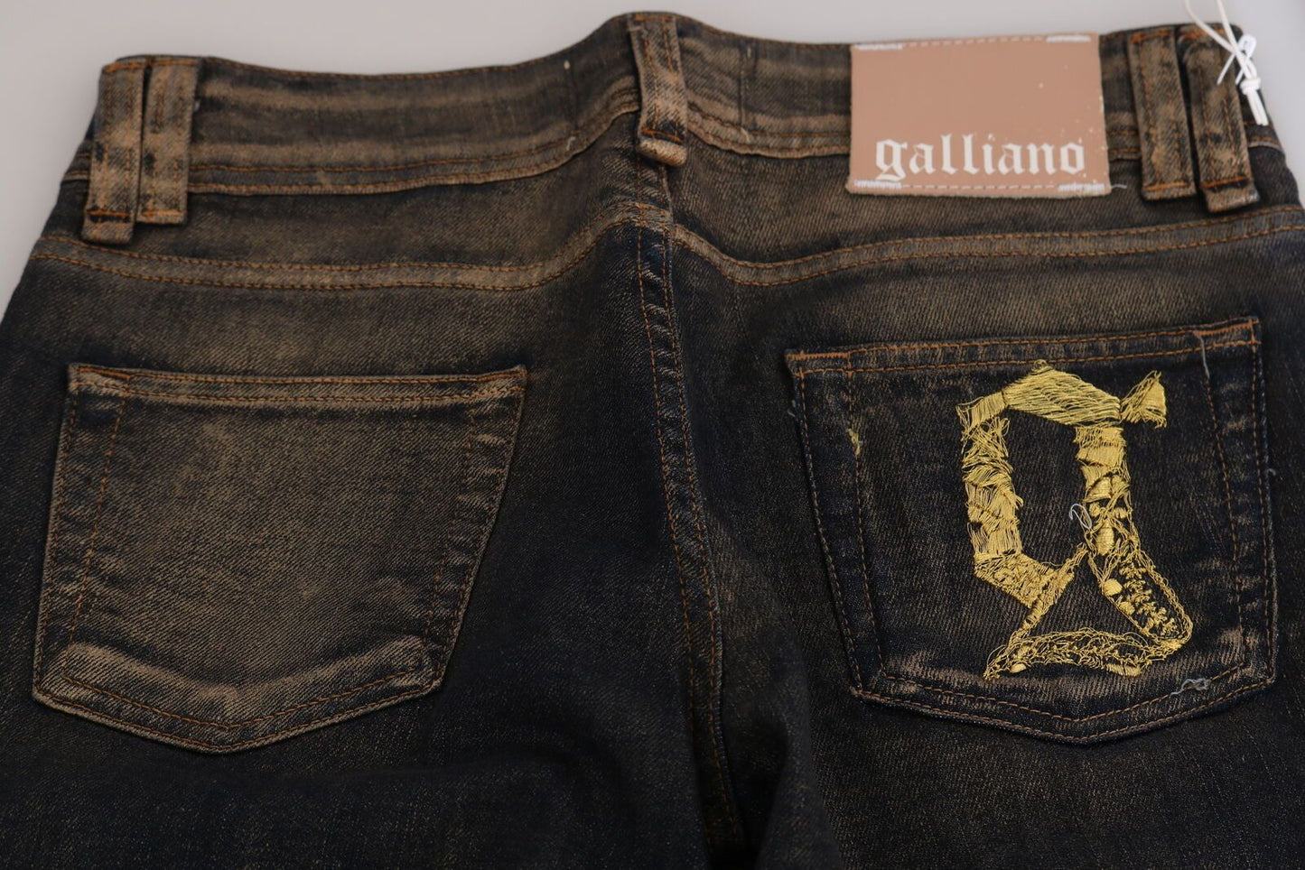 John Galliano Pantalones vaqueros acampanados de cintura media lavados en negro Algodón