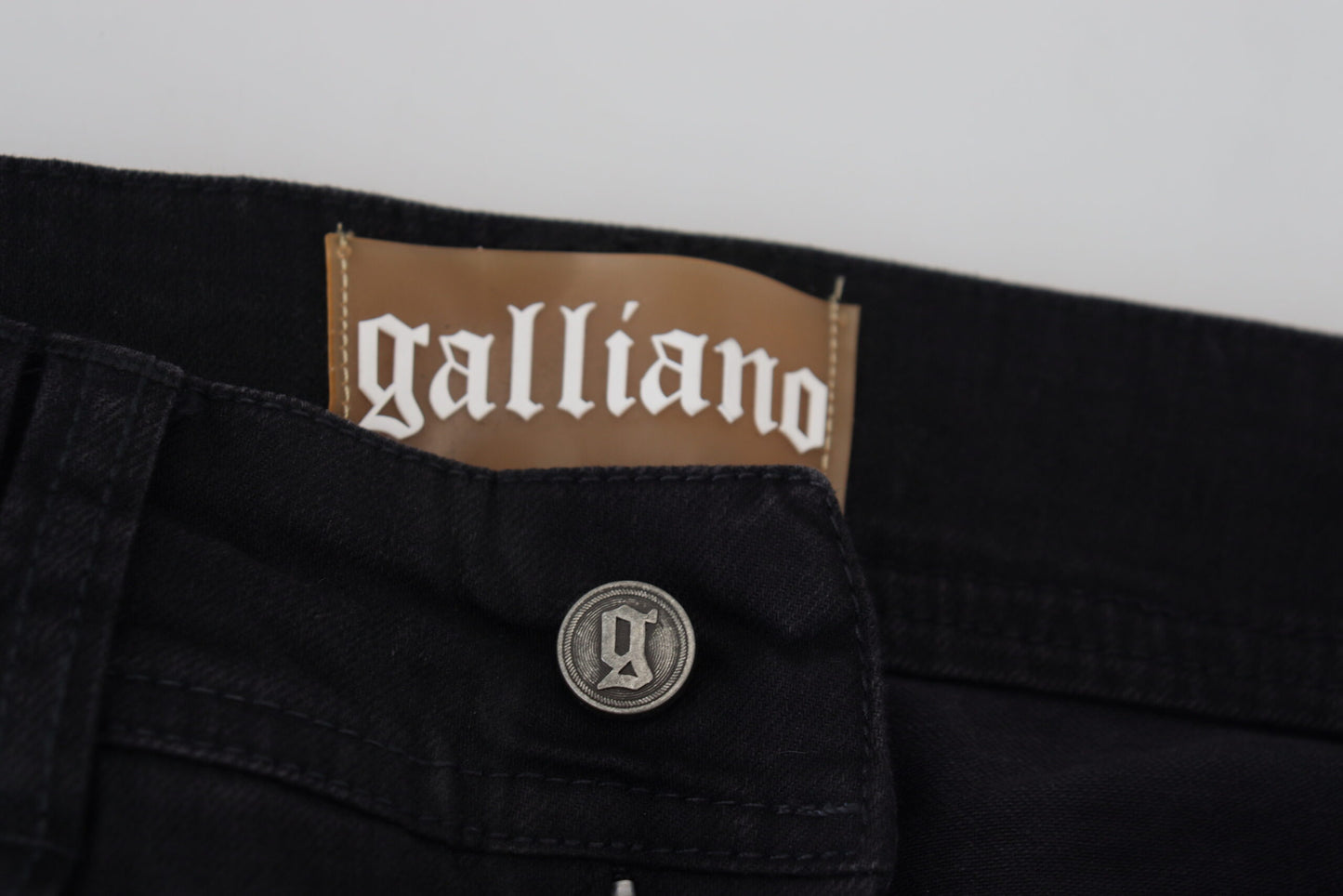 Vaqueros negros acampanados de talle medio Chic de John Galliano